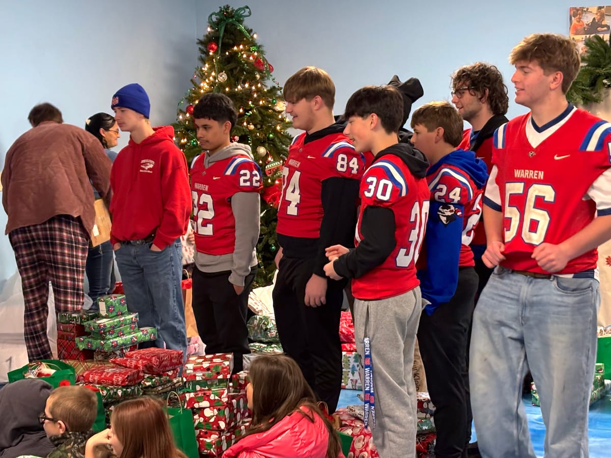 Pioneers deliver holiday cheer to Kids of the Community