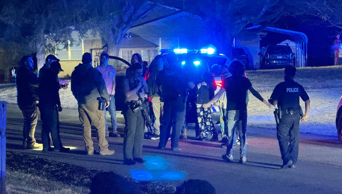 Lawmen swarm local house