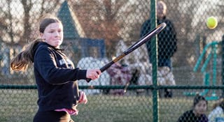Lady Pioneers making a racket