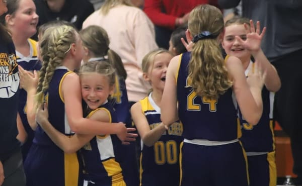 Hawks soar late, win battle of unbeatens